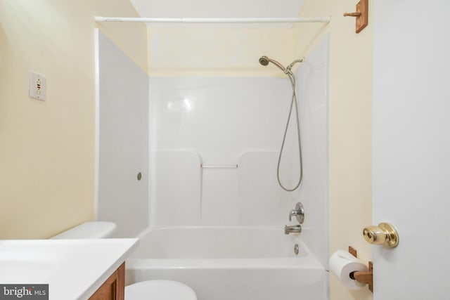 full bathroom featuring shower / bathing tub combination, toilet, and vanity