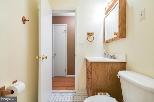 bathroom featuring toilet and vanity