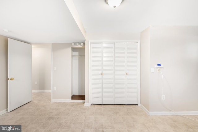 unfurnished bedroom with a closet