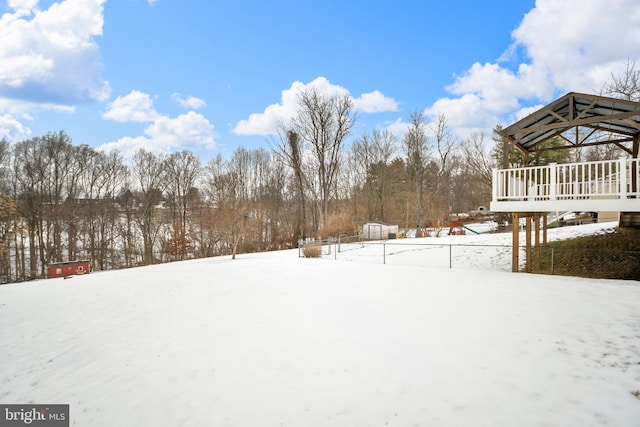 yard layered in snow featuring a gazebo