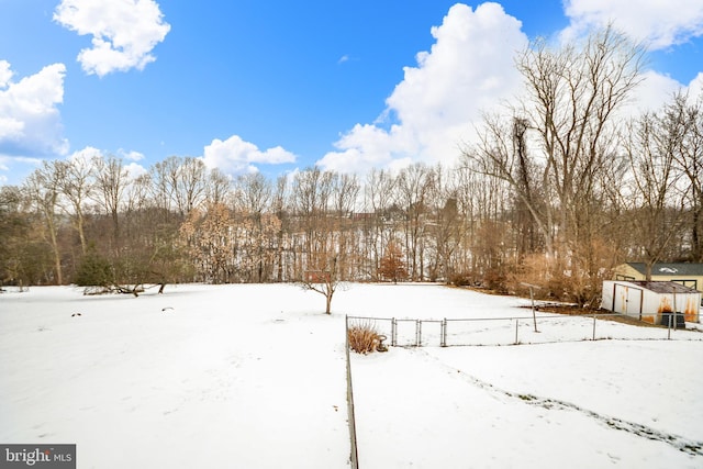 view of yard layered in snow