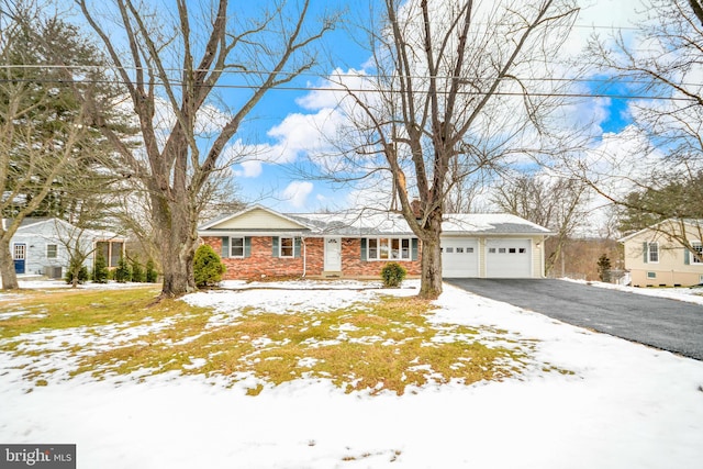 single story home with a garage