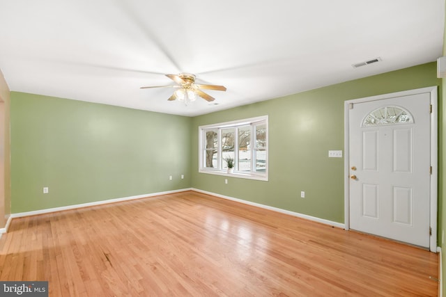 entrance foyer with ceiling fan and light hardwood / wood-style flooring