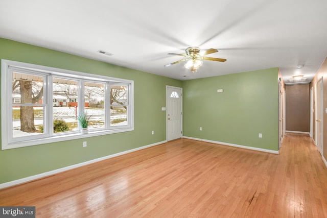 interior space with ceiling fan and light hardwood / wood-style floors