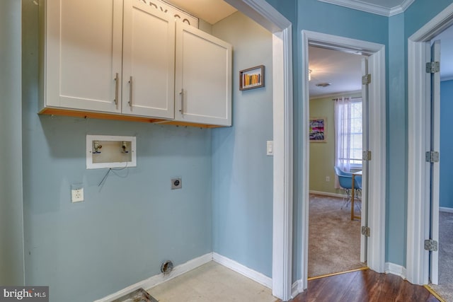 laundry room featuring cabinets, hookup for a washing machine, hookup for an electric dryer, carpet, and ornamental molding