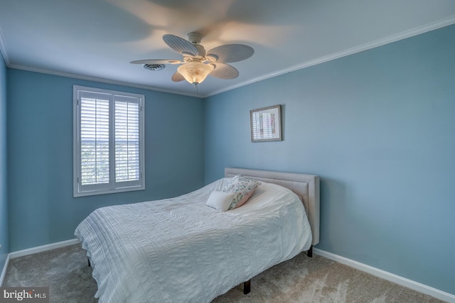 bedroom with carpet flooring, ceiling fan, and ornamental molding