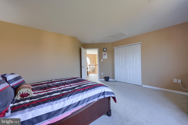 bedroom with light carpet and a closet