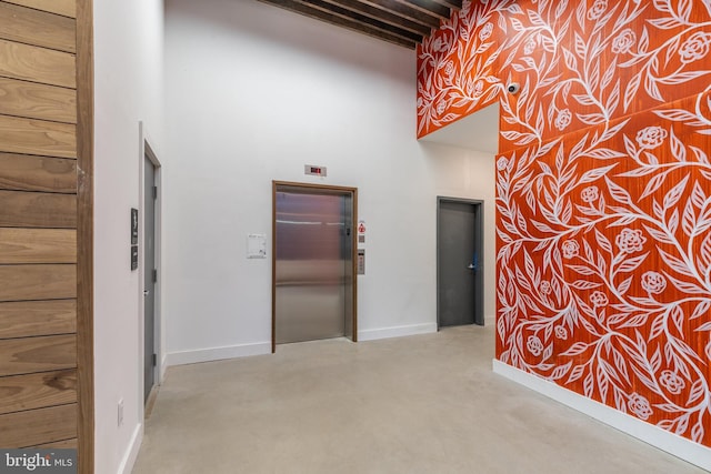 1501 N 31st St Unit 418, Philadelphia, PA 19121 - hall featuring elevator, finished concrete flooring, and a high ceiling