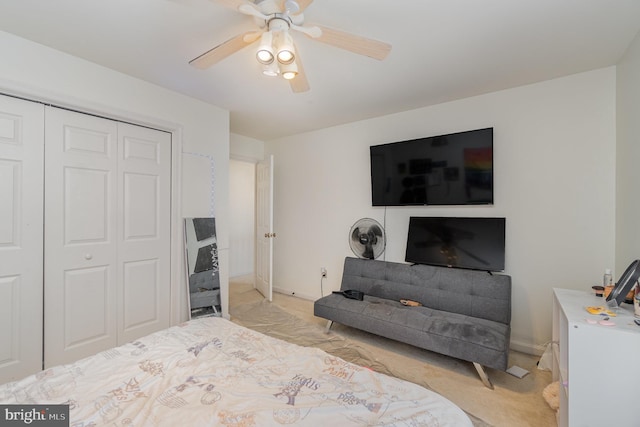 carpeted bedroom with a closet and ceiling fan