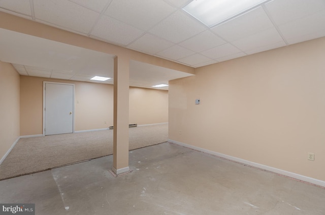 basement featuring a paneled ceiling