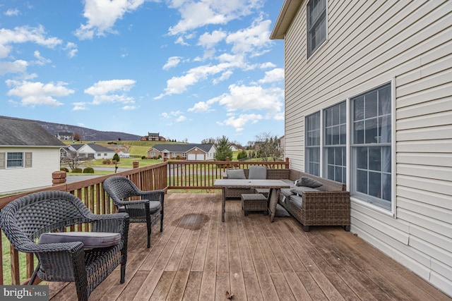 wooden deck featuring outdoor lounge area