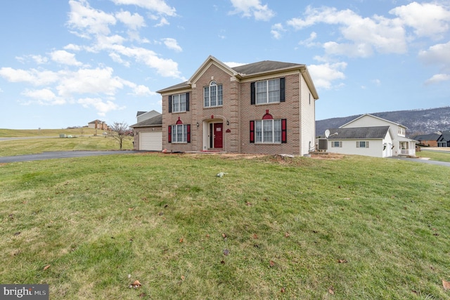 view of front of house featuring a garage and a front yard