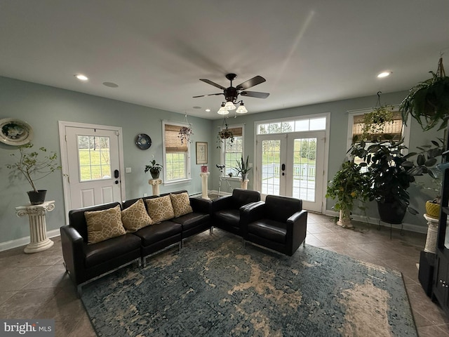 living room featuring tile patterned floors, ceiling fan, and french doors