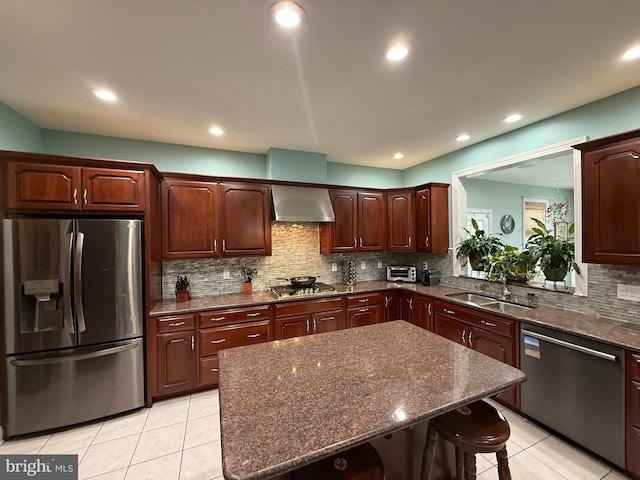 kitchen featuring sink, stainless steel appliances, backsplash, a breakfast bar, and light tile patterned flooring