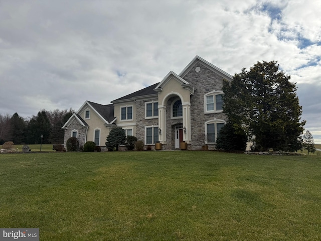 view of front of home with a front lawn