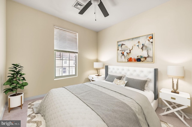 bedroom with ceiling fan and light carpet