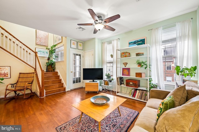 living room featuring ceiling fan and wood-type flooring