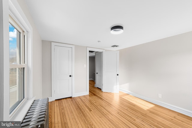 unfurnished bedroom featuring light hardwood / wood-style floors