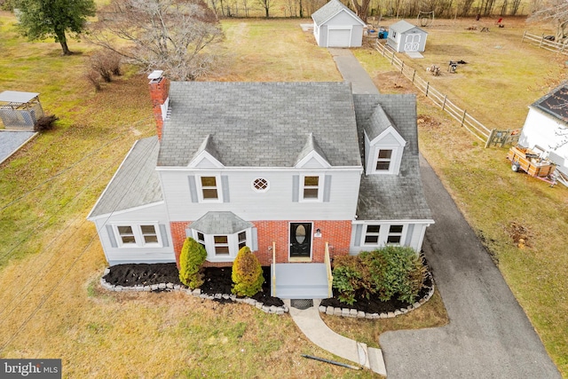 view of front of home featuring an outdoor structure