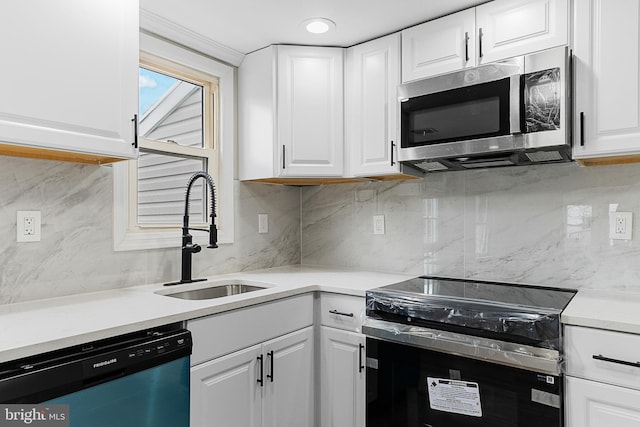 kitchen featuring sink, white cabinets, and stainless steel appliances