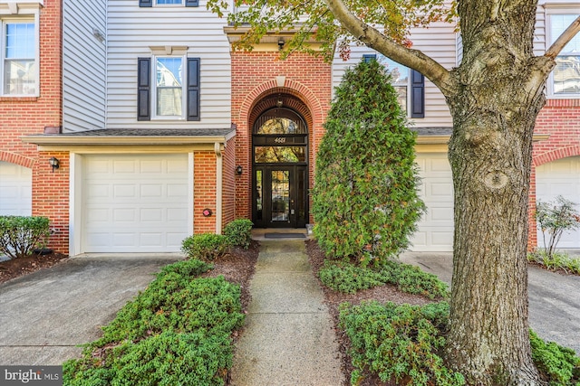 view of exterior entry featuring a garage