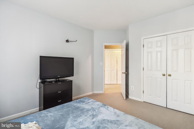 carpeted bedroom with a closet