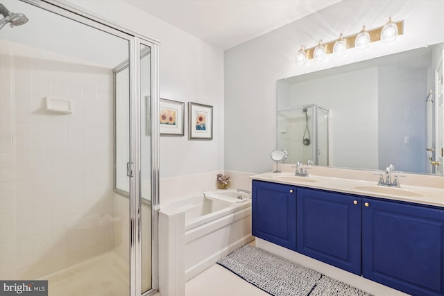 bathroom with tile patterned flooring, vanity, and plus walk in shower