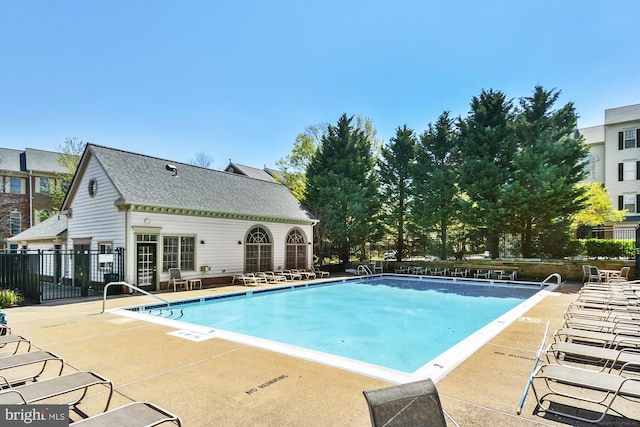 view of swimming pool featuring a patio area