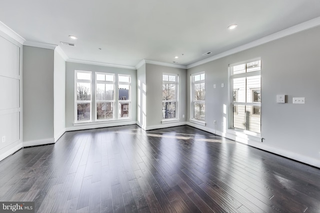 spare room featuring dark hardwood / wood-style flooring and ornamental molding