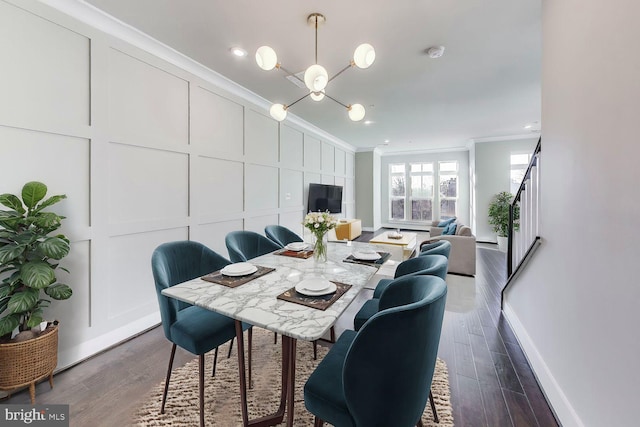 dining area with crown molding and dark hardwood / wood-style flooring