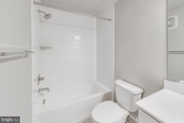 full bathroom with vanity, toilet, and tiled shower / bath