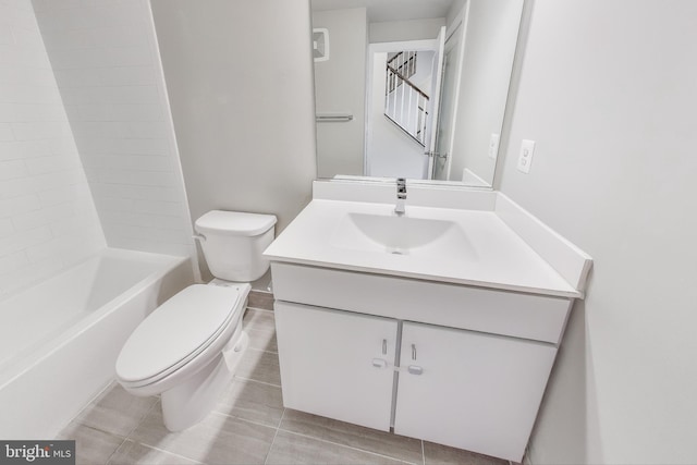 full bathroom featuring tile patterned floors, vanity, bathing tub / shower combination, and toilet