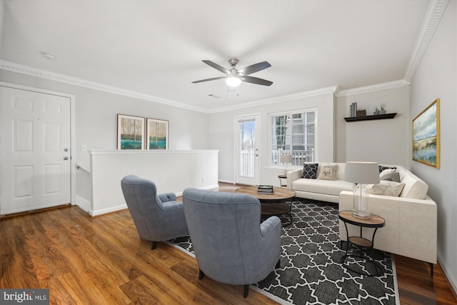 living room featuring ceiling fan, crown molding, and dark wood-type flooring