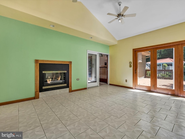 spare room with french doors, high vaulted ceiling, and ceiling fan