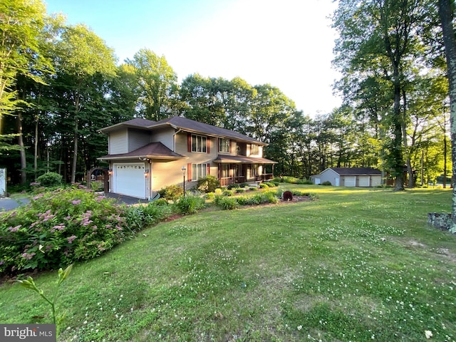 view of front of house featuring a front yard and a garage