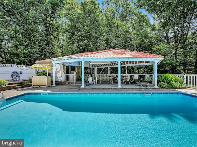 view of swimming pool featuring a gazebo and a patio