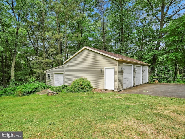 garage featuring a yard