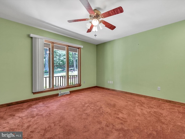 carpeted empty room featuring ceiling fan