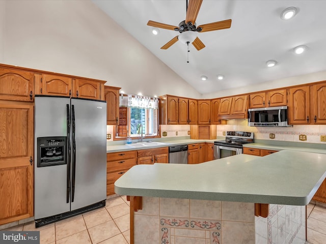 kitchen featuring high vaulted ceiling, sink, ceiling fan, light tile patterned flooring, and stainless steel appliances