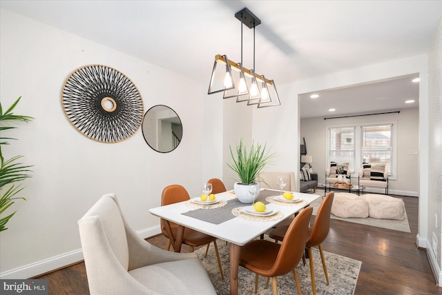 dining area featuring dark hardwood / wood-style floors