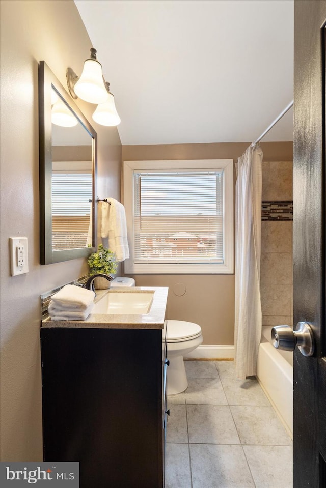 full bathroom featuring tile patterned flooring, vanity, toilet, and shower / bathtub combination with curtain