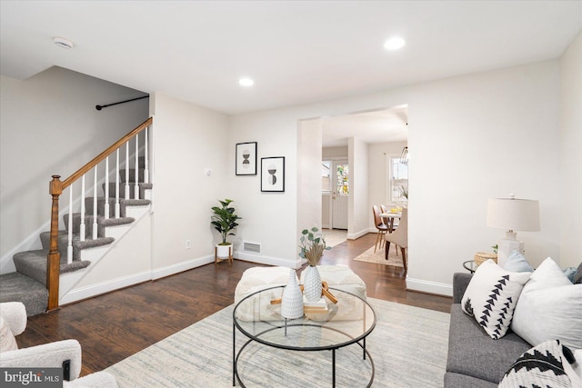 living room featuring dark hardwood / wood-style flooring