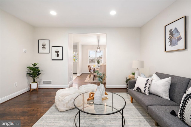 living room featuring dark hardwood / wood-style floors