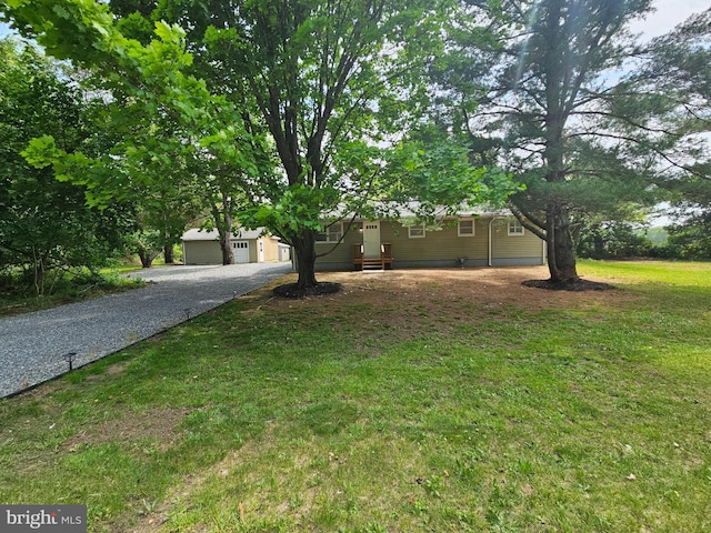 view of front of home with a garage and a front yard