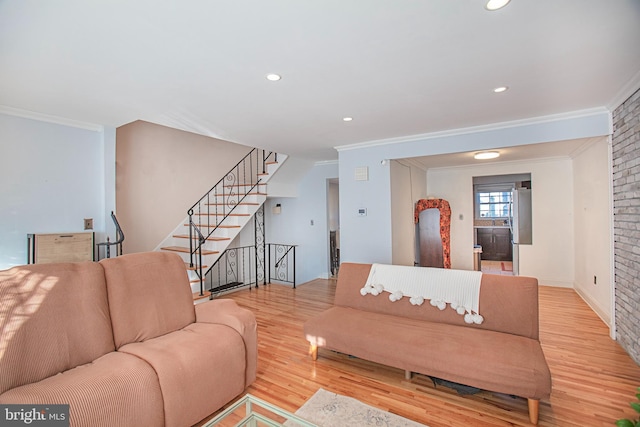 living room with light wood finished floors, recessed lighting, ornamental molding, baseboards, and stairs