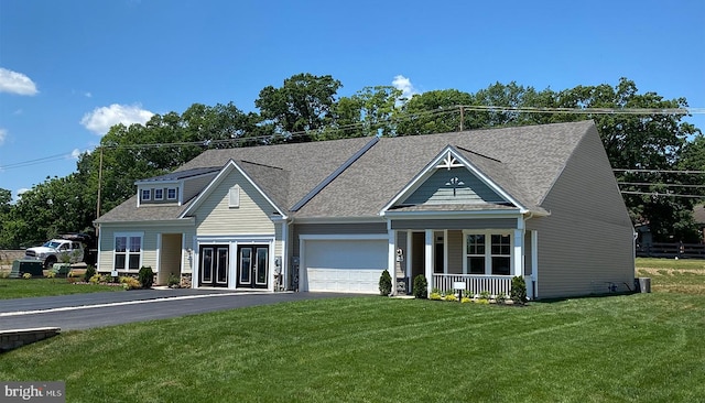 view of front facade with a front lawn and a porch