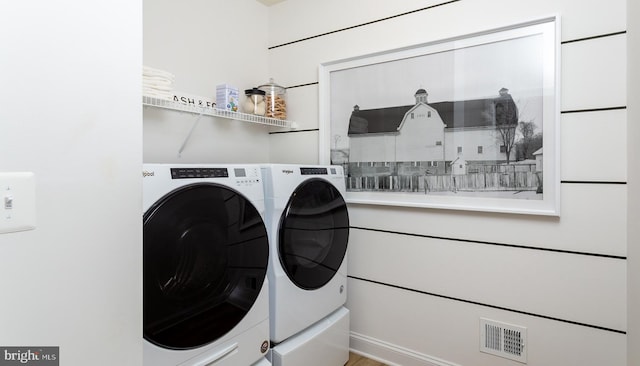 laundry room with independent washer and dryer