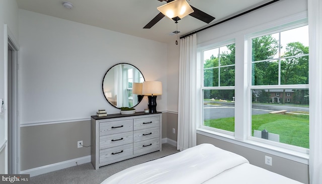 carpeted bedroom with ceiling fan