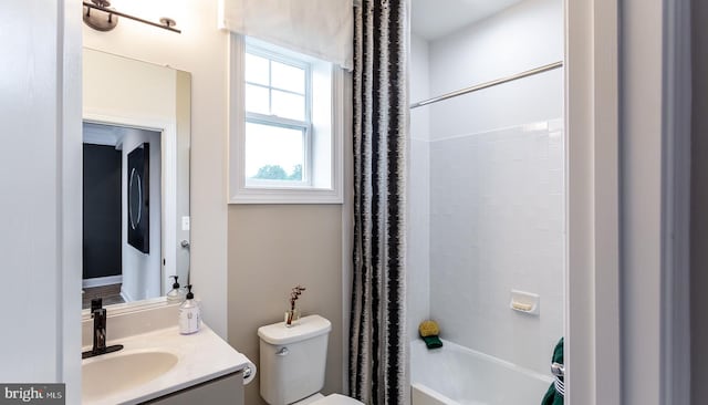 full bathroom with vanity, toilet, and shower / tub combo with curtain