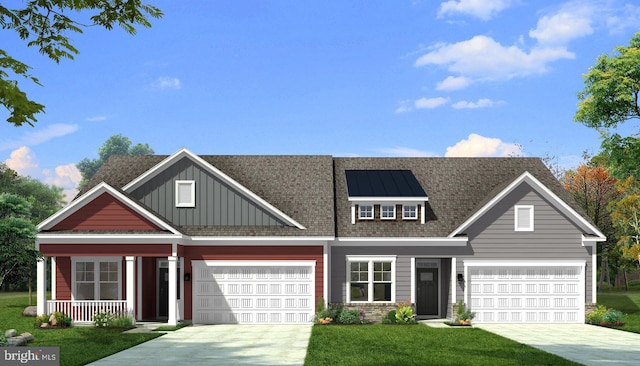 view of front of house with a front lawn, covered porch, and a garage